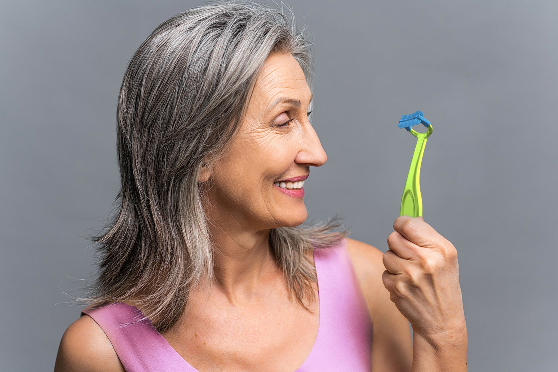 Load video: A video demonstrating how WonderProx is designed to clean teeth next to gaps and dentures.